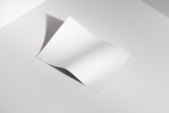 Minimalist white paper mockup with soft shadows on a clean background, ideal for elegant presentation and design showcases.